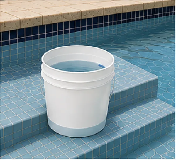 White bucket sitting on the first step of a pool